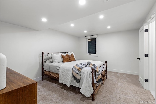 bedroom featuring light colored carpet