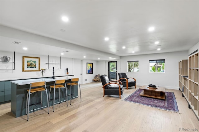 living room with light hardwood / wood-style flooring