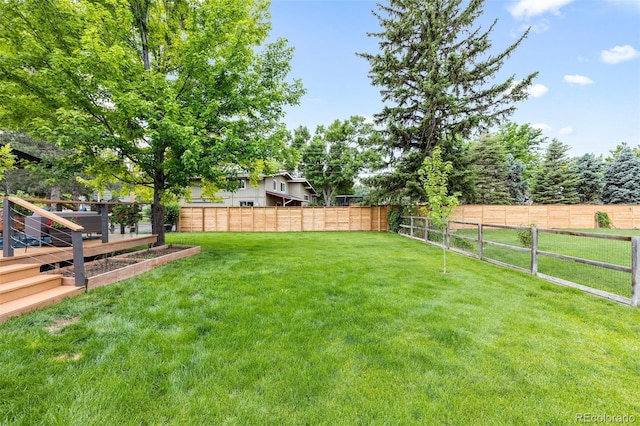 view of yard featuring a deck