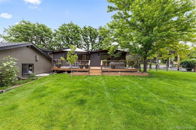 view of yard featuring a wooden deck