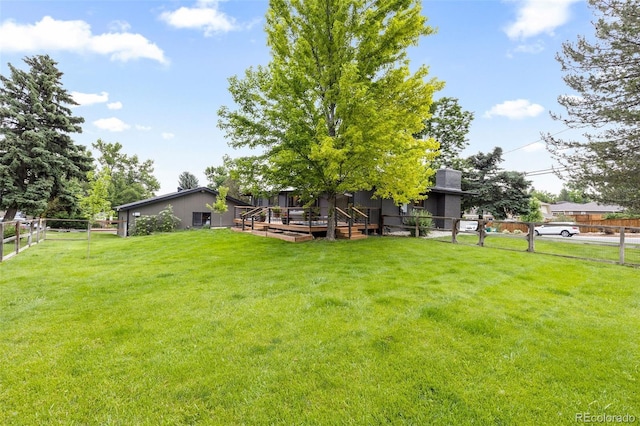 view of yard featuring a wooden deck