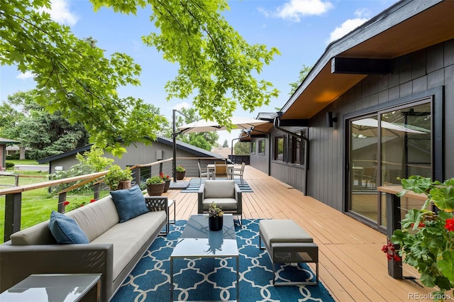 wooden deck featuring outdoor lounge area