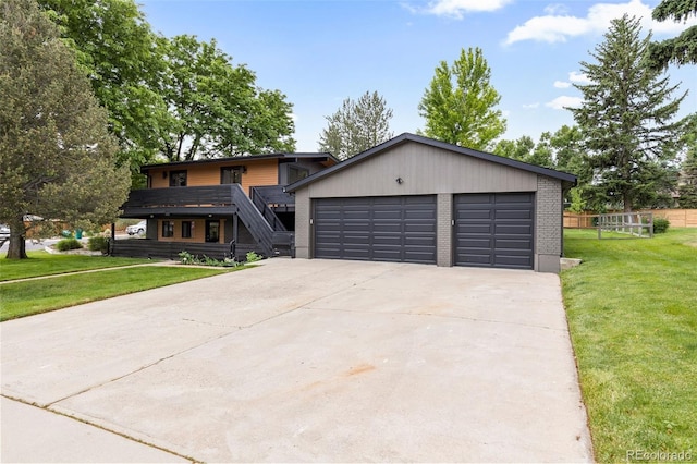 view of front of house with a front lawn and a garage