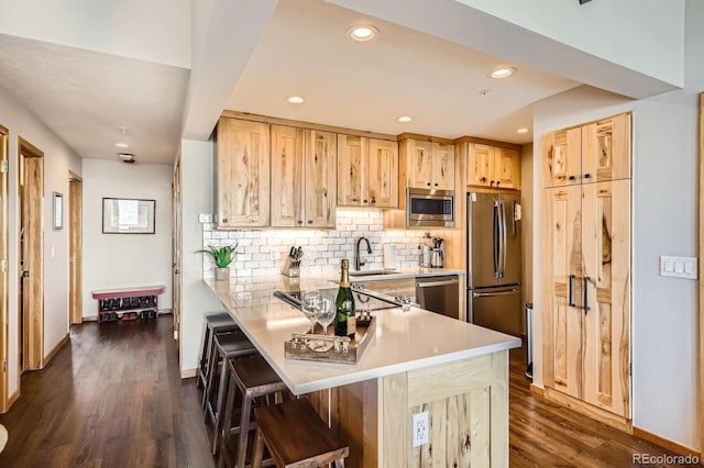 91400 Ryan Gulch Rd Unit 91427, Silverthorne, CO 80498 - kitchen featuring appliances with stainless steel finishes, dark wood-style flooring, and light brown cabinetry