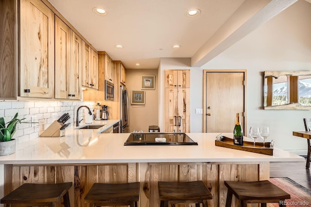 91400 Ryan Gulch Rd Unit 91427, Silverthorne, CO 80498 - kitchen with light countertops, appliances with stainless steel finishes, a sink, and recessed lighting