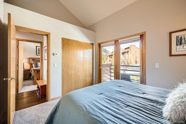 91400 Ryan Gulch Rd Unit 91427, Silverthorne, CO 80498 - carpeted bedroom featuring access to exterior, wood finished floors, a closet, and vaulted ceiling