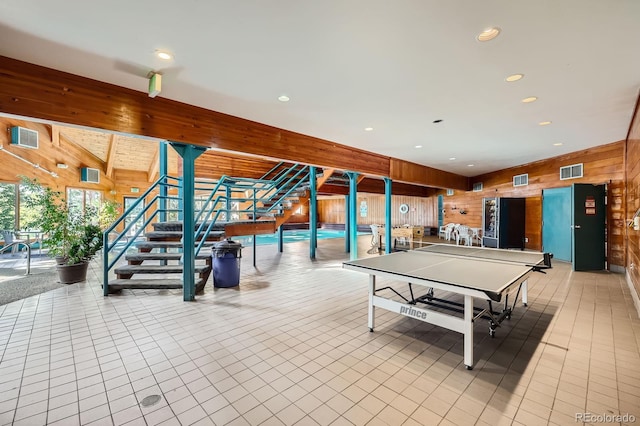 91400 Ryan Gulch Rd Unit 91427, Silverthorne, CO 80498 - recreation room featuring wood walls, recessed lighting, visible vents, and a wall unit AC