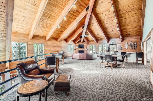 91400 Ryan Gulch Rd Unit 91427, Silverthorne, CO 80498 - sitting room featuring wooden walls, beam ceiling, high vaulted ceiling, carpet, and wood ceiling