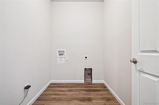 laundry area featuring dark wood-style floors, washer hookup, hookup for an electric dryer, laundry area, and baseboards