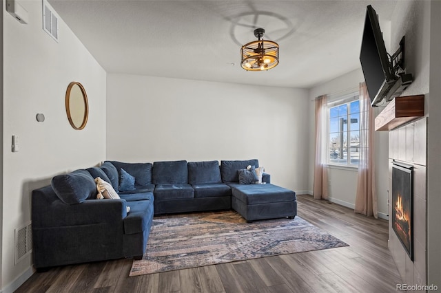 living room with dark hardwood / wood-style flooring