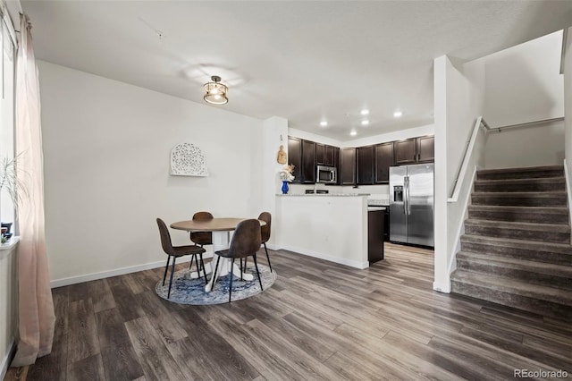 dining room with hardwood / wood-style flooring