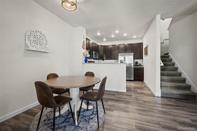 dining room with wood-type flooring