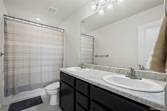 full bathroom featuring shower / tub combo, vanity, tile patterned floors, and toilet