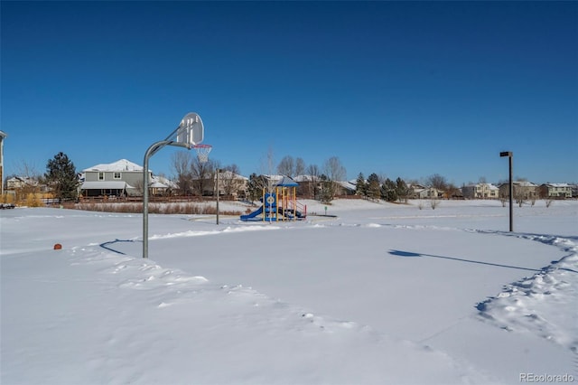 view of sport court featuring a playground