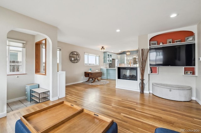 unfurnished living room featuring wood-type flooring