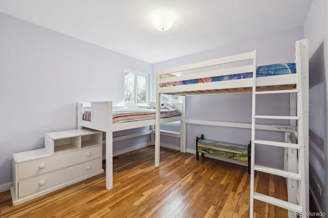 bedroom with wood-type flooring