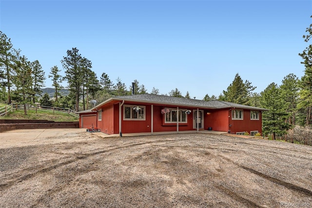 4776 Red Rock Dr, Larkspur, CO 80118 - view of front of home featuring a garage and driveway