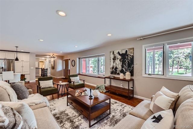 4776 Red Rock Dr, Larkspur, CO 80118 - living room featuring light wood-style flooring, baseboards, and recessed lighting