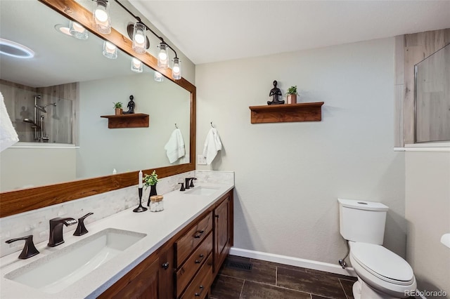 4776 Red Rock Dr, Larkspur, CO 80118 - bathroom with toilet, baseboards, a shower, and double vanity