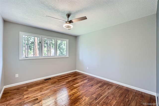4776 Red Rock Dr, Larkspur, CO 80118 - unfurnished room featuring a ceiling fan, wood finished floors, baseboards, and a textured ceiling