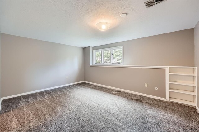 4776 Red Rock Dr, Larkspur, CO 80118 - carpeted empty room with baseboards and a textured ceiling