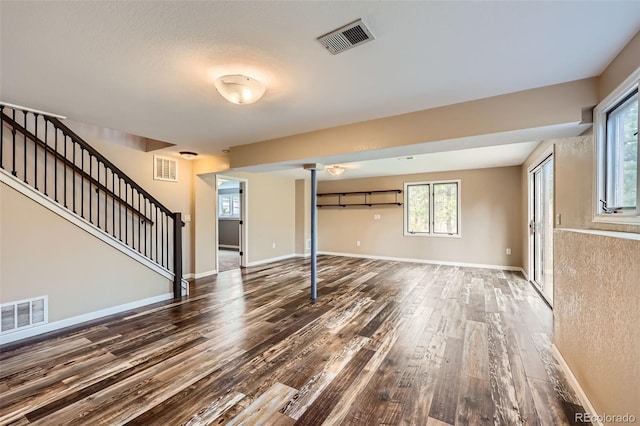 4776 Red Rock Dr, Larkspur, CO 80118 - unfurnished living room with wood finished floors, stairway, and baseboards