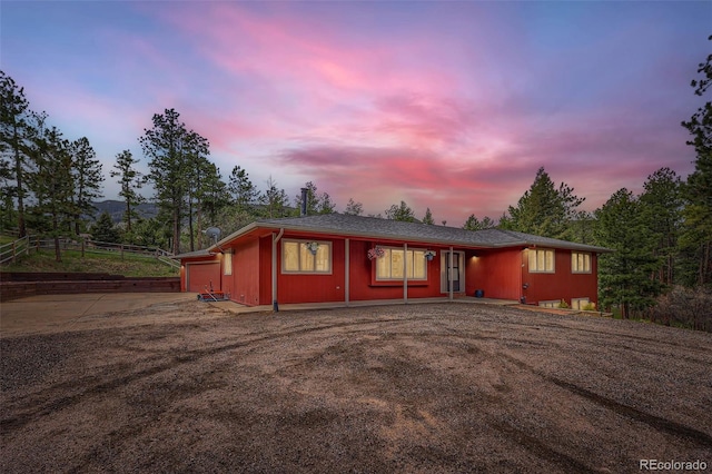 4776 Red Rock Dr, Larkspur, CO 80118 - view of front facade with concrete driveway and an attached garage