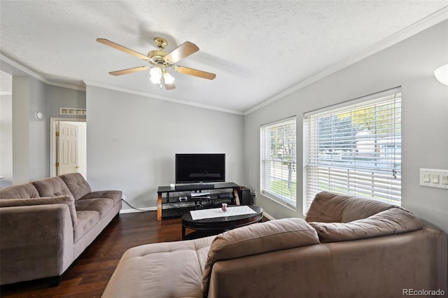 living room featuring a textured ceiling, ceiling fan, dark hardwood / wood-style floors, and plenty of natural light