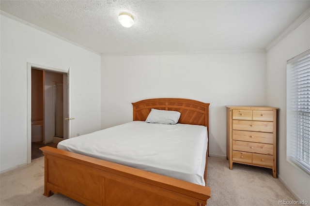 bedroom with crown molding, a textured ceiling, and light colored carpet