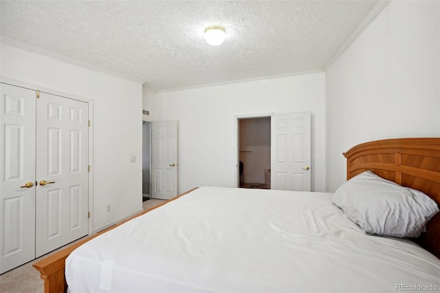 bedroom with a closet and a textured ceiling