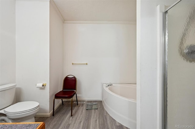 bathroom with shower with separate bathtub, a textured ceiling, toilet, hardwood / wood-style flooring, and ornamental molding