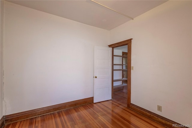 spare room featuring hardwood / wood-style flooring