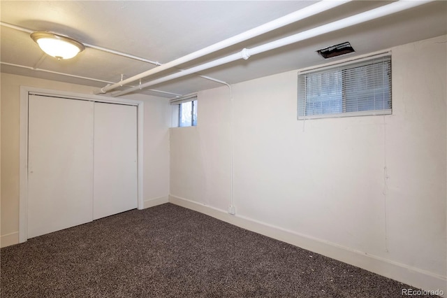 basement with dark colored carpet