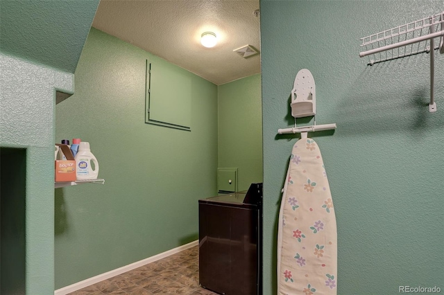 bathroom with a textured ceiling