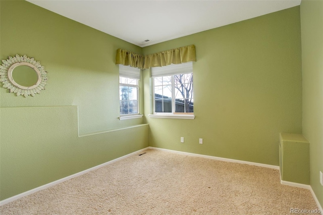 unfurnished room with carpet