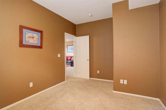 empty room with light colored carpet