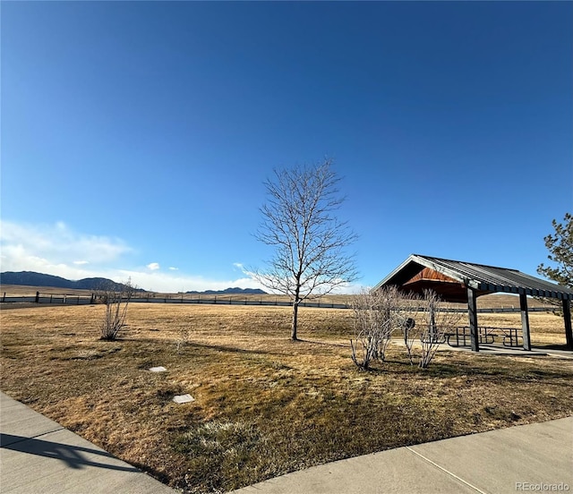 view of yard with a gazebo, a mountain view, and a rural view