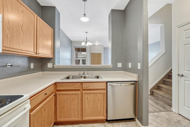 kitchen featuring a chandelier, decorative light fixtures, light countertops, stainless steel dishwasher, and a sink