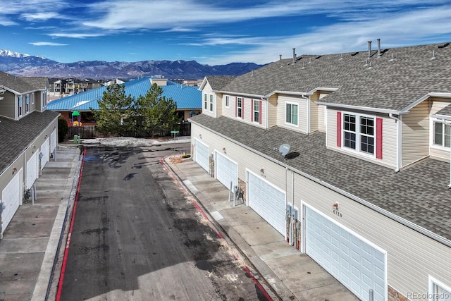 exterior space featuring a mountain view and a residential view