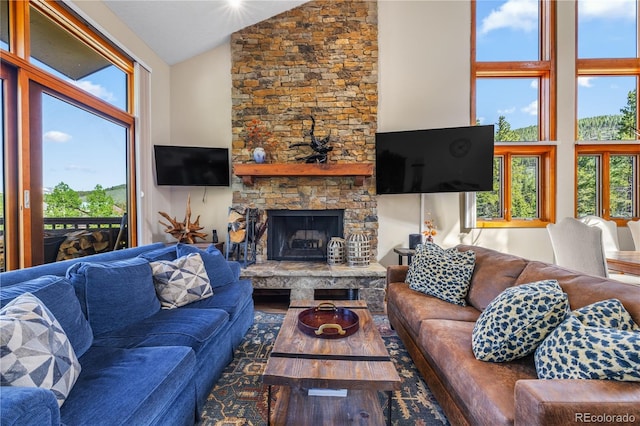 22300 US Highway 6 Unit 1746, Dillon, CO 80435 - living area featuring high vaulted ceiling, a fireplace, and wood finished floors