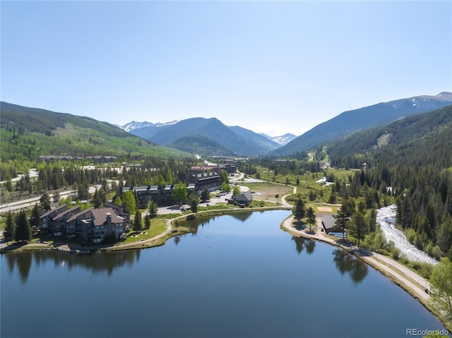22300 US Highway 6 Unit 1746, Dillon, CO 80435 - drone / aerial view of a heavily wooded area and a water and mountain view