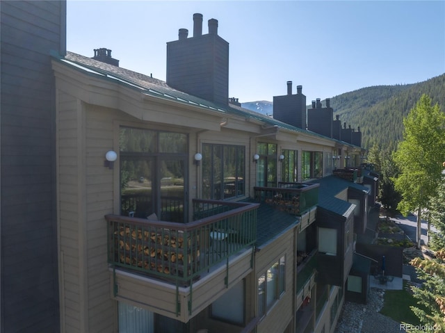 22300 US Highway 6 Unit 1746, Dillon, CO 80435 - rear view of property with a chimney and a mountain view