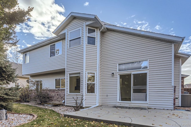 rear view of house featuring a patio