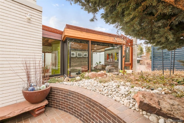 view of patio with a sunroom