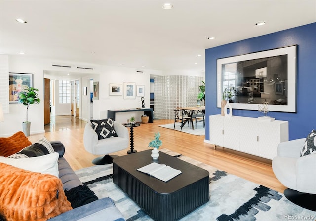 living room featuring recessed lighting and wood finished floors