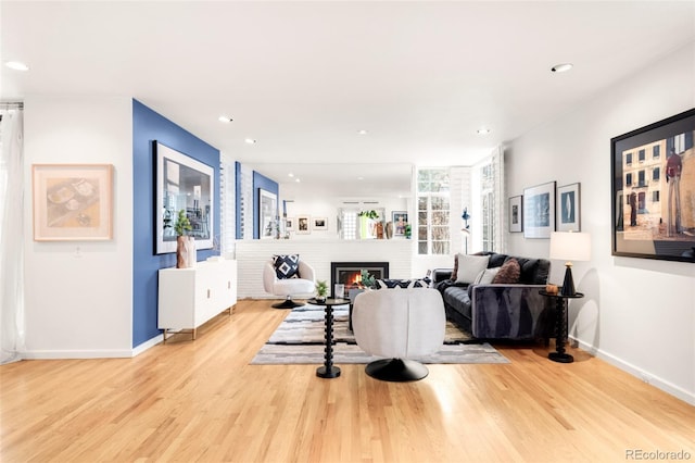 living area with recessed lighting and wood finished floors