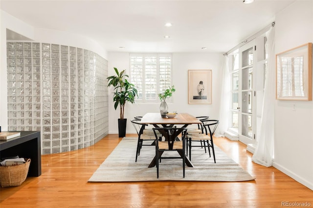 dining area with recessed lighting, baseboards, and light wood finished floors