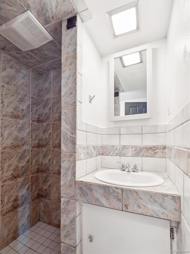 3050 S Delaware St, Englewood, CO 80110 - full bath with vanity and a tile shower