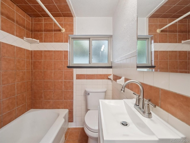 3050 S Delaware St, Englewood, CO 80110 - bathroom with bathtub / shower combination, tile walls, tile patterned floors, and vanity