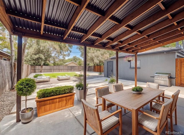 3050 S Delaware St, Englewood, CO 80110 - fenced backyard with a patio, outdoor dining space, and area for grilling